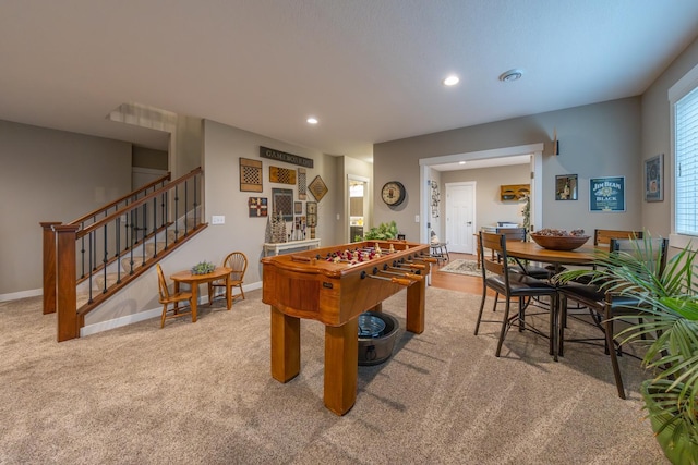 game room with light colored carpet