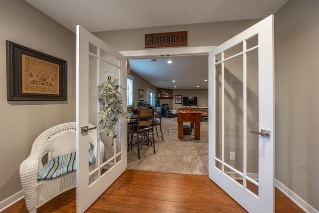 hallway featuring french doors and hardwood / wood-style flooring