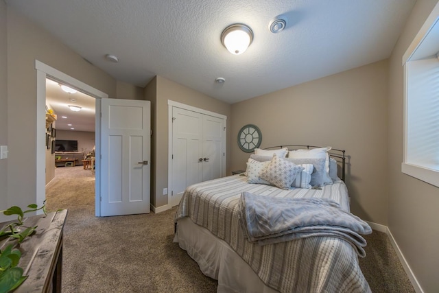 carpeted bedroom featuring a closet