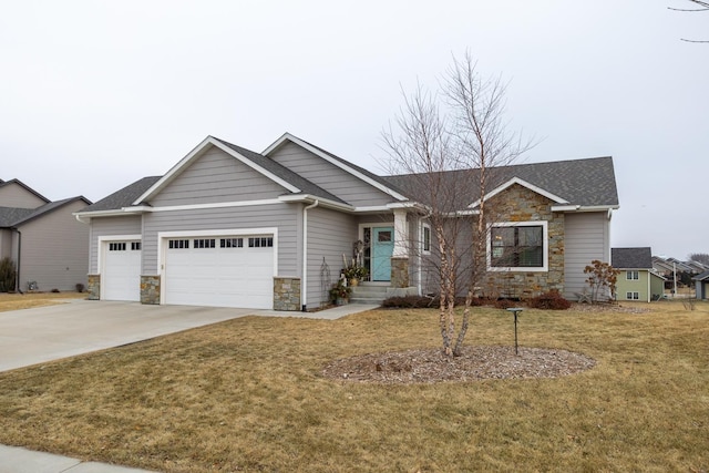 view of front facade with a front yard and a garage