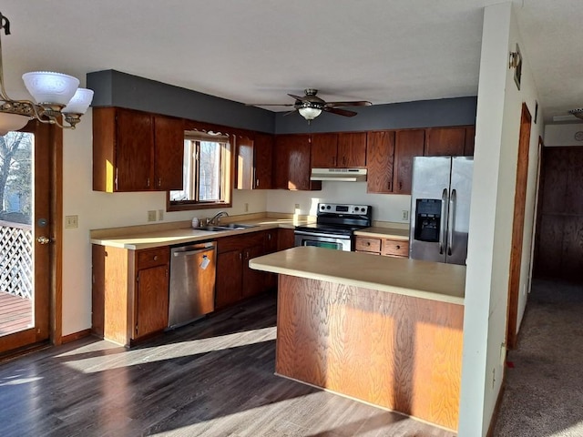 kitchen with ceiling fan, dark hardwood / wood-style flooring, sink, and appliances with stainless steel finishes