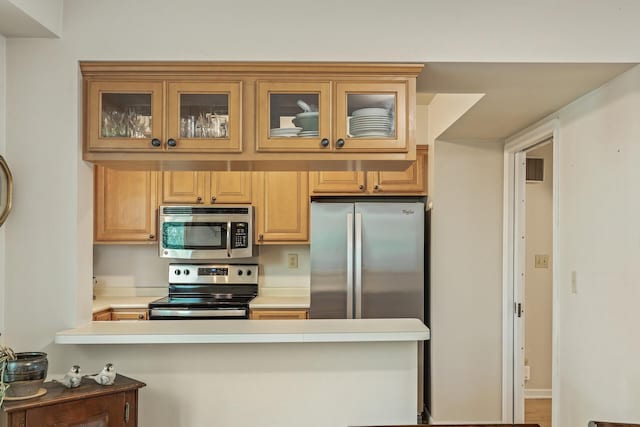 kitchen featuring kitchen peninsula and stainless steel appliances