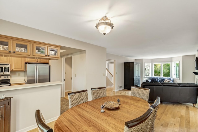 dining room with light hardwood / wood-style floors