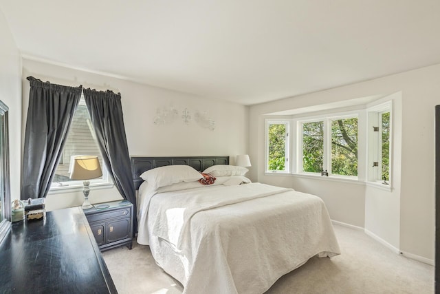 bedroom with light carpet