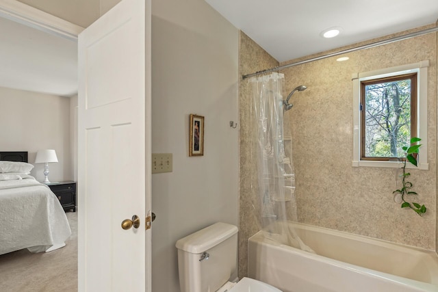 bathroom featuring toilet and shower / tub combo