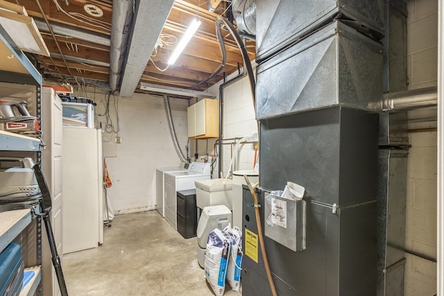 utility room featuring separate washer and dryer and water heater