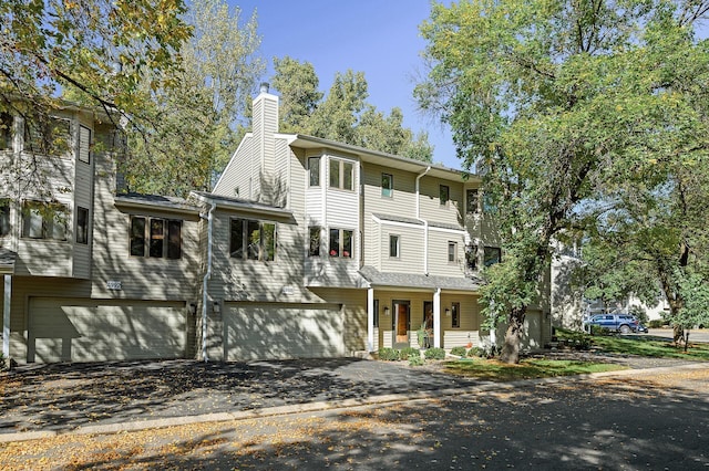 view of front of home with covered porch and a garage