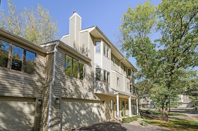 view of property exterior featuring a garage