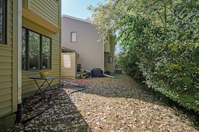 view of property exterior with central AC unit