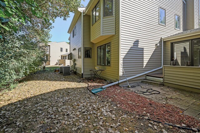 view of home's exterior with cooling unit