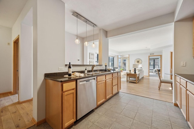 kitchen with dishwasher, kitchen peninsula, hanging light fixtures, and sink