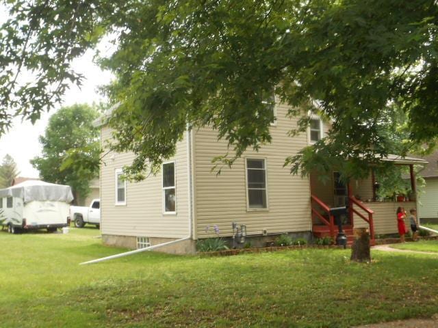 view of home's exterior featuring a lawn