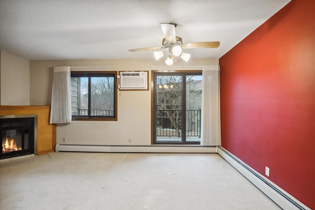 unfurnished living room featuring a baseboard radiator, a wall mounted AC, a textured ceiling, and carpet flooring