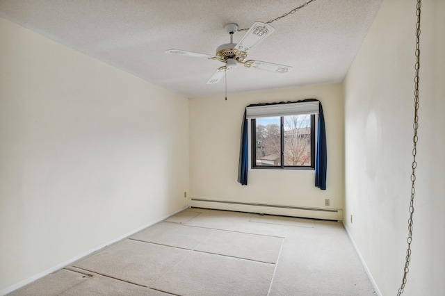 empty room with ceiling fan, a textured ceiling, and baseboard heating