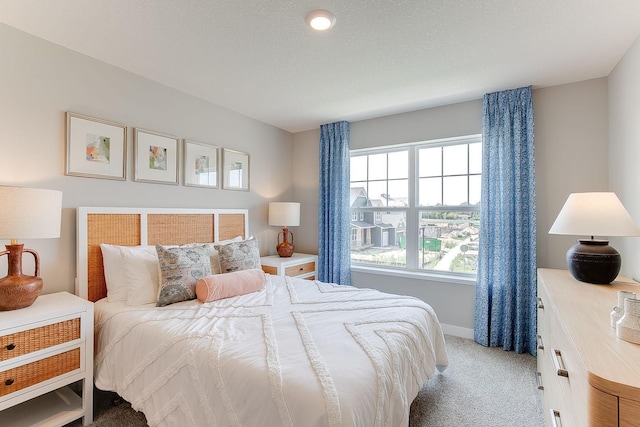 bedroom featuring light colored carpet