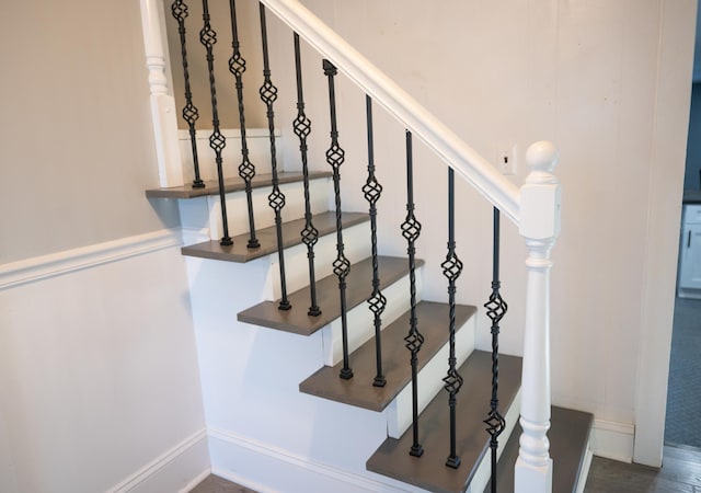 staircase featuring hardwood / wood-style floors