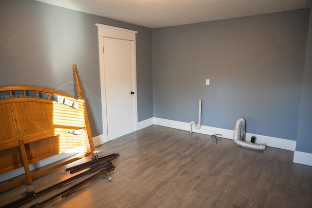 unfurnished bedroom featuring dark wood-type flooring