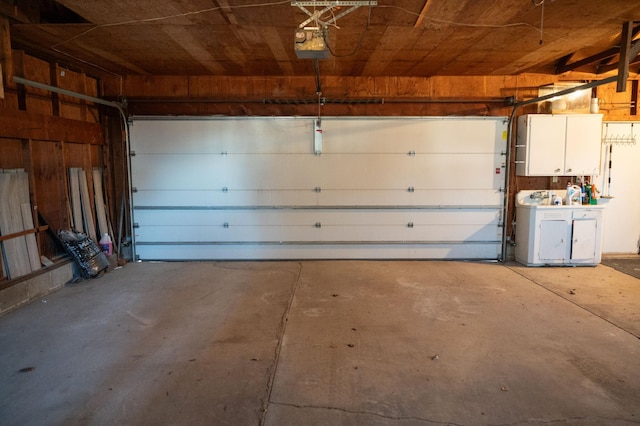 garage featuring a garage door opener and washer and clothes dryer