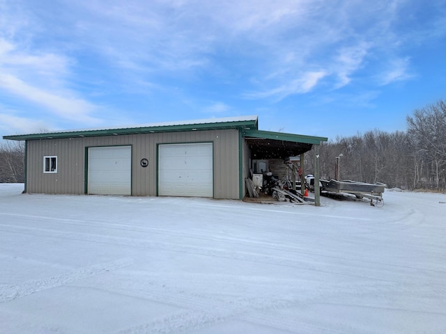 view of snow covered garage