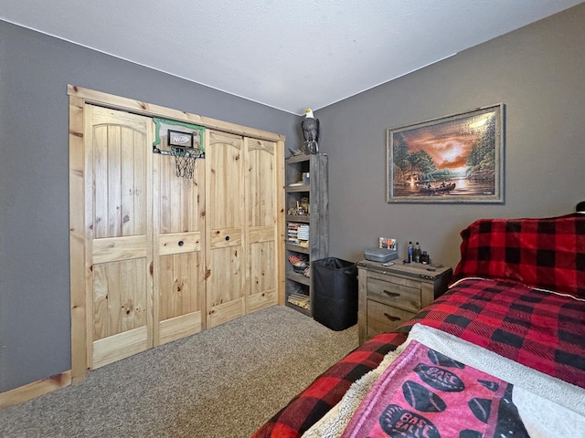 carpeted bedroom featuring a closet