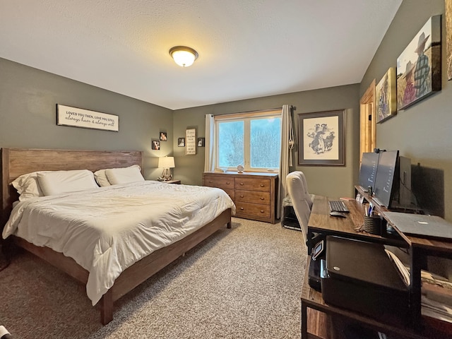 carpeted bedroom featuring a textured ceiling