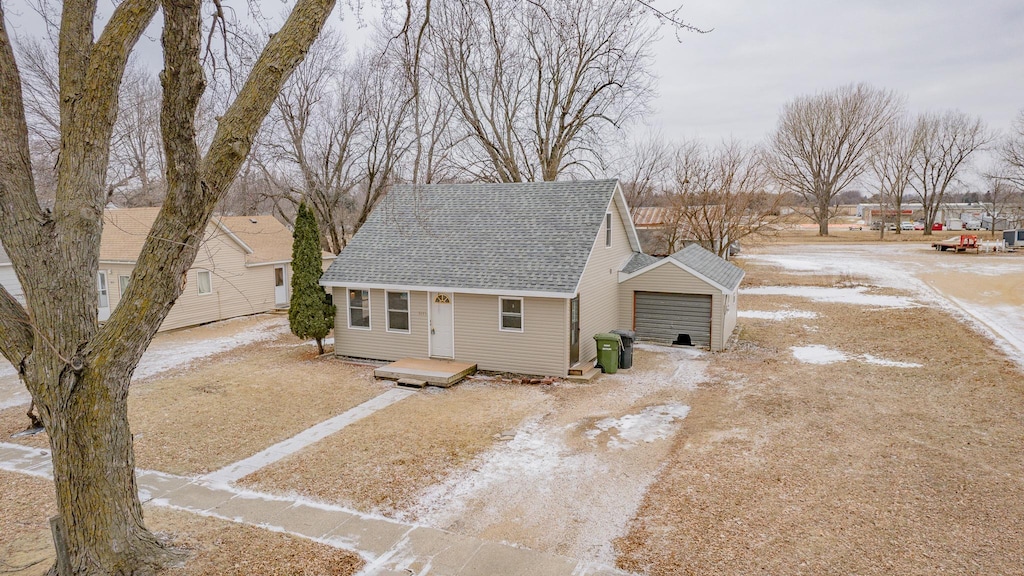 view of front of home with an outbuilding and a garage