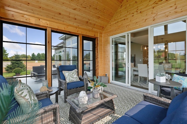 sunroom featuring lofted ceiling