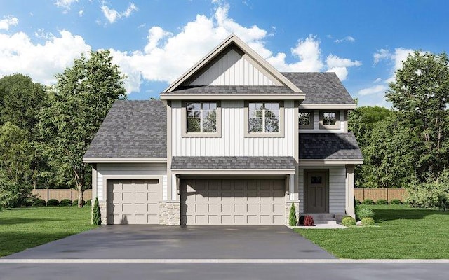 view of front of home featuring a garage and a front lawn