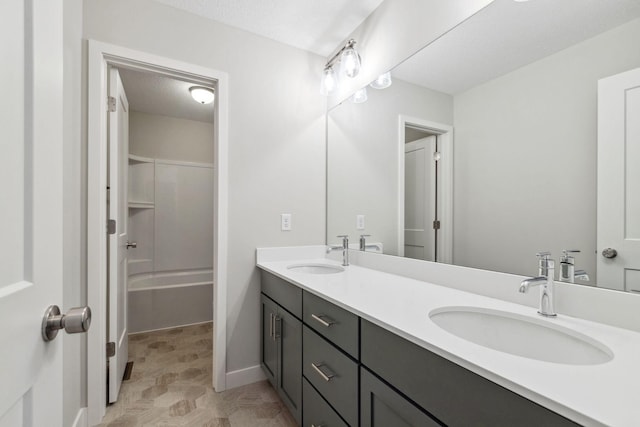 bathroom with vanity and a textured ceiling