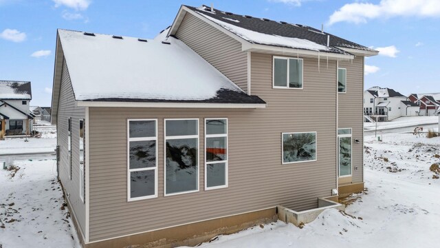 view of snow covered property