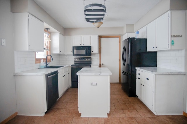 kitchen featuring black appliances, decorative backsplash, a kitchen island, sink, and white cabinetry