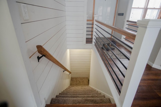 stairway with wooden walls