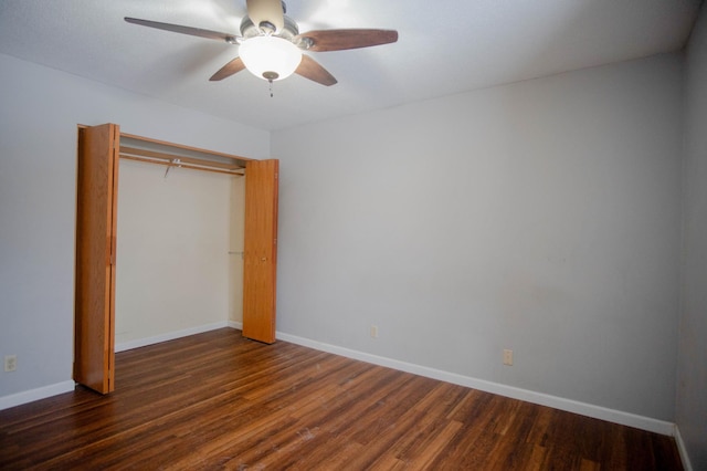 unfurnished bedroom with a closet, ceiling fan, and dark wood-type flooring