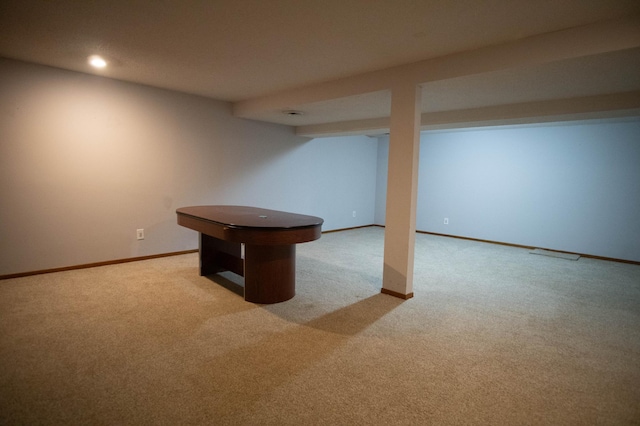 basement with light colored carpet