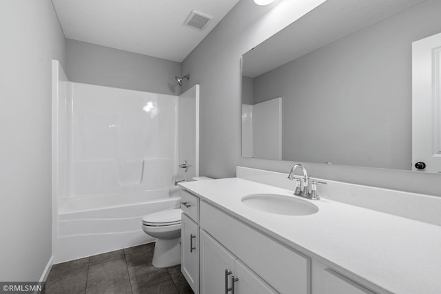 full bathroom featuring toilet, bathtub / shower combination, tile patterned flooring, and vanity