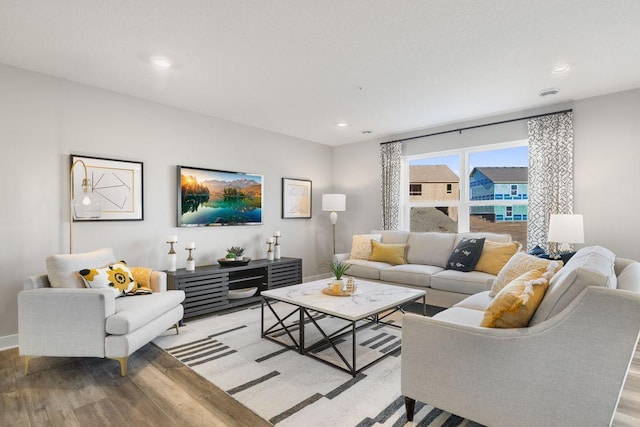 living room with light hardwood / wood-style flooring