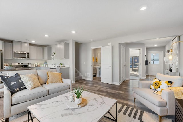 living room with dark hardwood / wood-style flooring