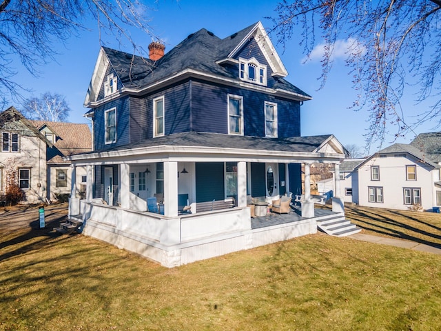 exterior space featuring a porch and a yard