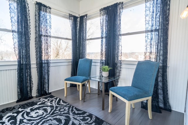 sitting room with a healthy amount of sunlight and hardwood / wood-style flooring