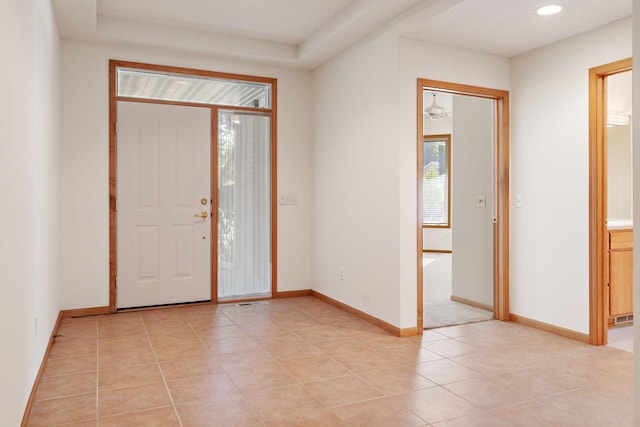 tiled foyer entrance featuring ceiling fan