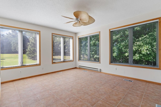 unfurnished sunroom with a baseboard radiator and ceiling fan