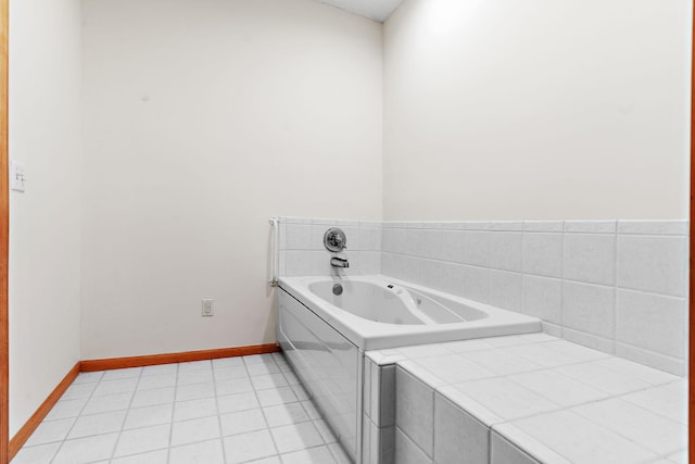 bathroom featuring tile patterned flooring and a relaxing tiled tub