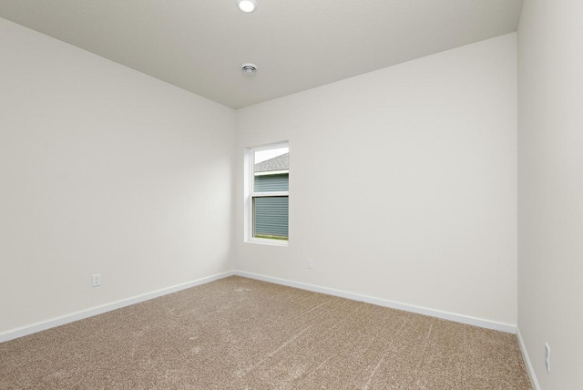 unfurnished room featuring carpet