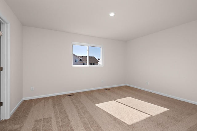 unfurnished room with carpet floors