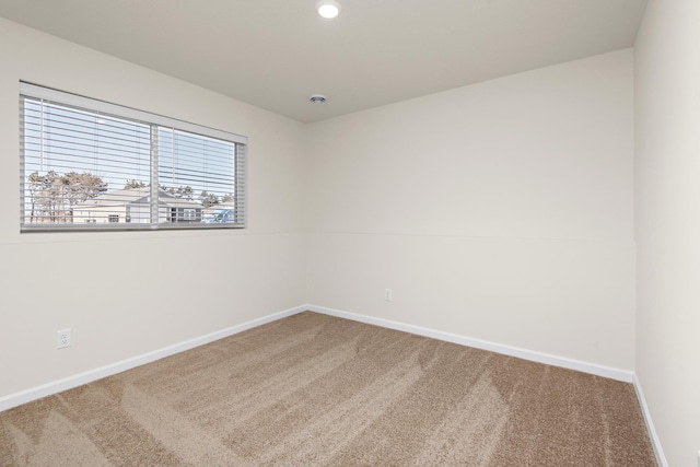 unfurnished room with carpet floors