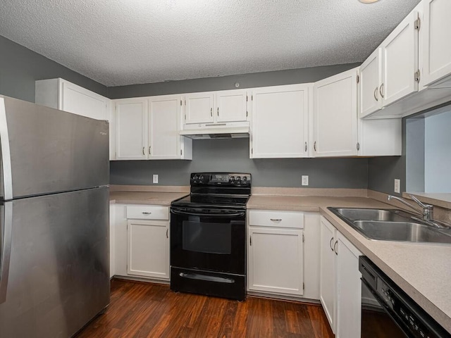 kitchen with sink, a textured ceiling, white cabinetry, and black appliances