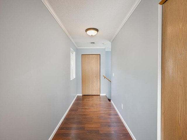 hall featuring dark hardwood / wood-style flooring and crown molding