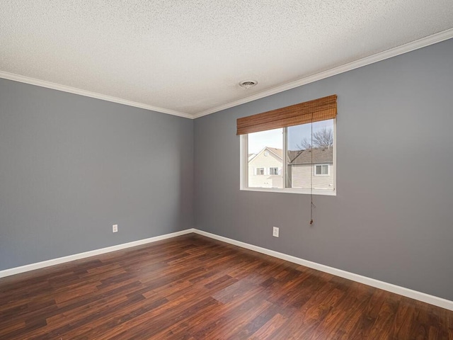 unfurnished room featuring a textured ceiling, dark wood-type flooring, and crown molding