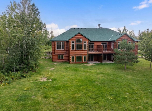 back of property featuring a patio, a deck, and a lawn