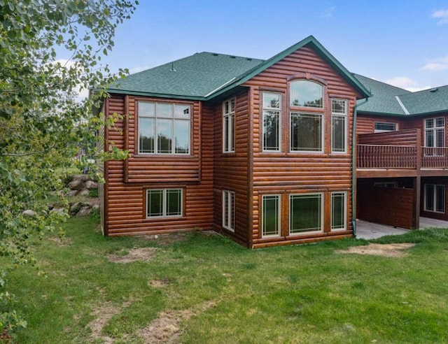 rear view of house with a lawn